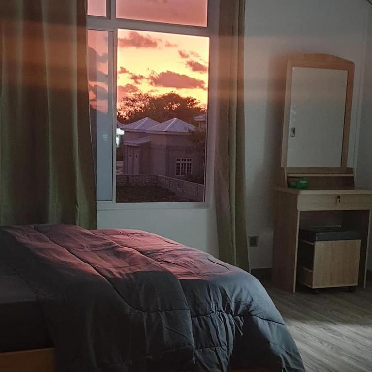 Postel nebo postele na pokoji v ubytování Shitha Inn