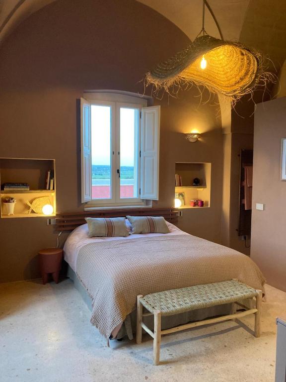 Postel nebo postele na pokoji v ubytování Antica Masseria le Monache
