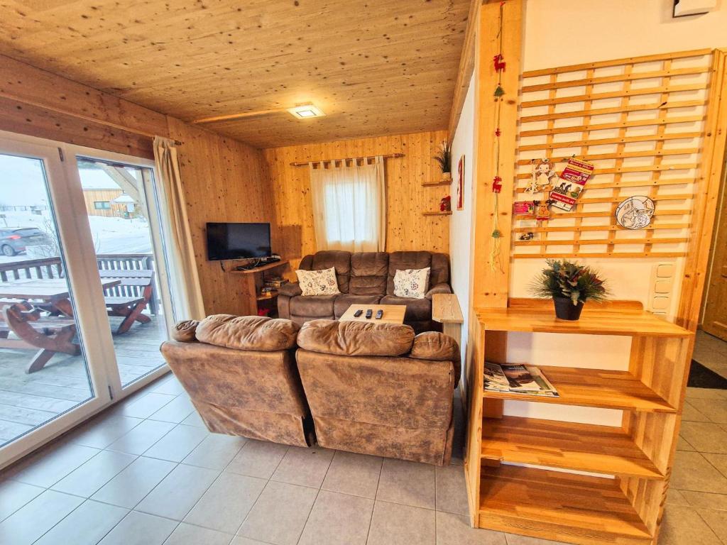 a living room with a couch and a table at Kreischberg 14b in Sankt Lorenzen ob Murau