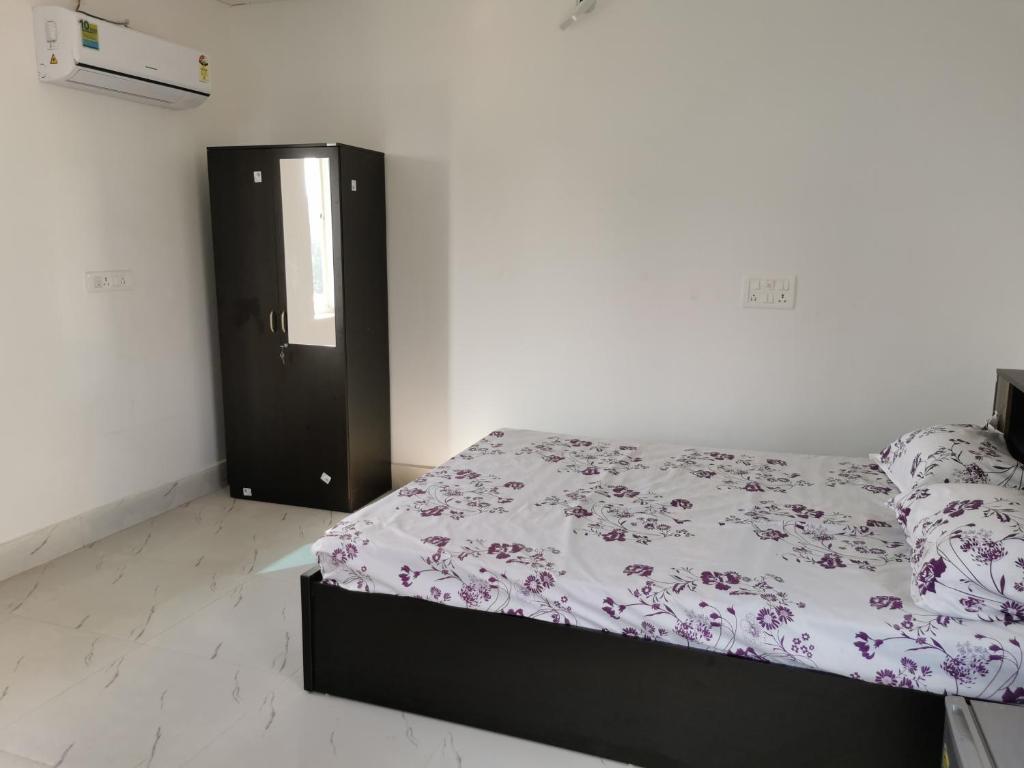 Postel nebo postele na pokoji v ubytování Chairosana Mansion