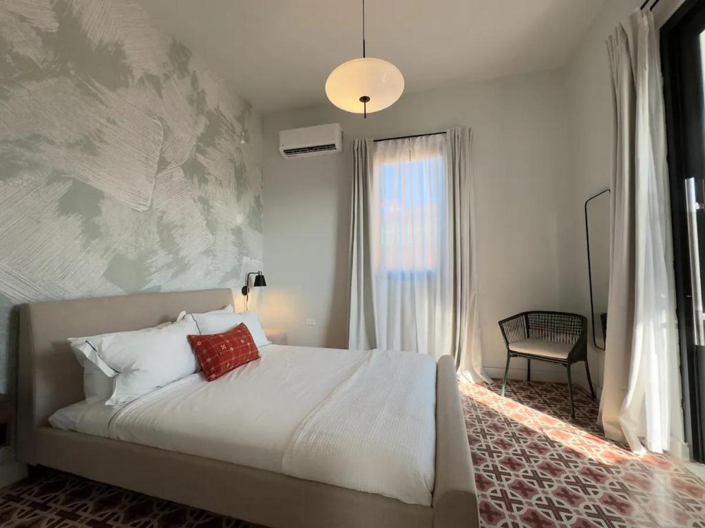 Postel nebo postele na pokoji v ubytování Patio Elba Boutique Hotel
