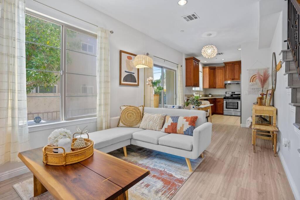 a living room with a couch and a table at modern design home near disneyland in Fullerton