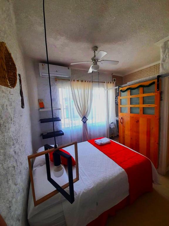Postel nebo postele na pokoji v ubytování Hostal Cann's House