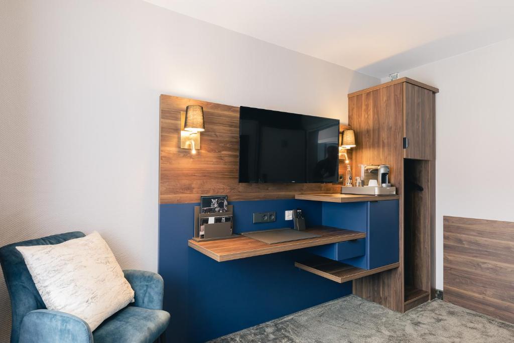 TV a/nebo společenská místnost v ubytování Hotel & Restaurant Rose