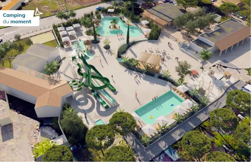 an overhead view of a pool with a water park at Mobil-Home camping 4**** LA MARINE in Le Grau-du-Roi