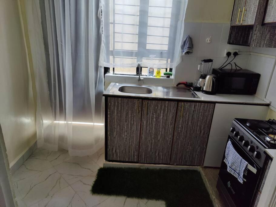 Kuchyň nebo kuchyňský kout v ubytování Mupa's Luxury Condo I