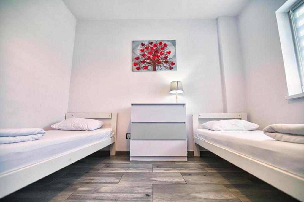 Posteľ alebo postele v izbe v ubytovaní Apartamenty Izabell by Housine