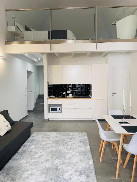 a living room with a couch and a table at Luxury Loft 35 in Cagliari