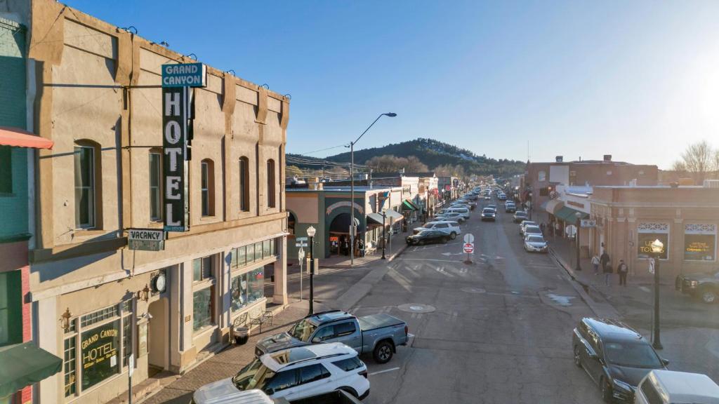 a city street with cars parked on the street at The Historic Grand Canyon Hotel in Williams