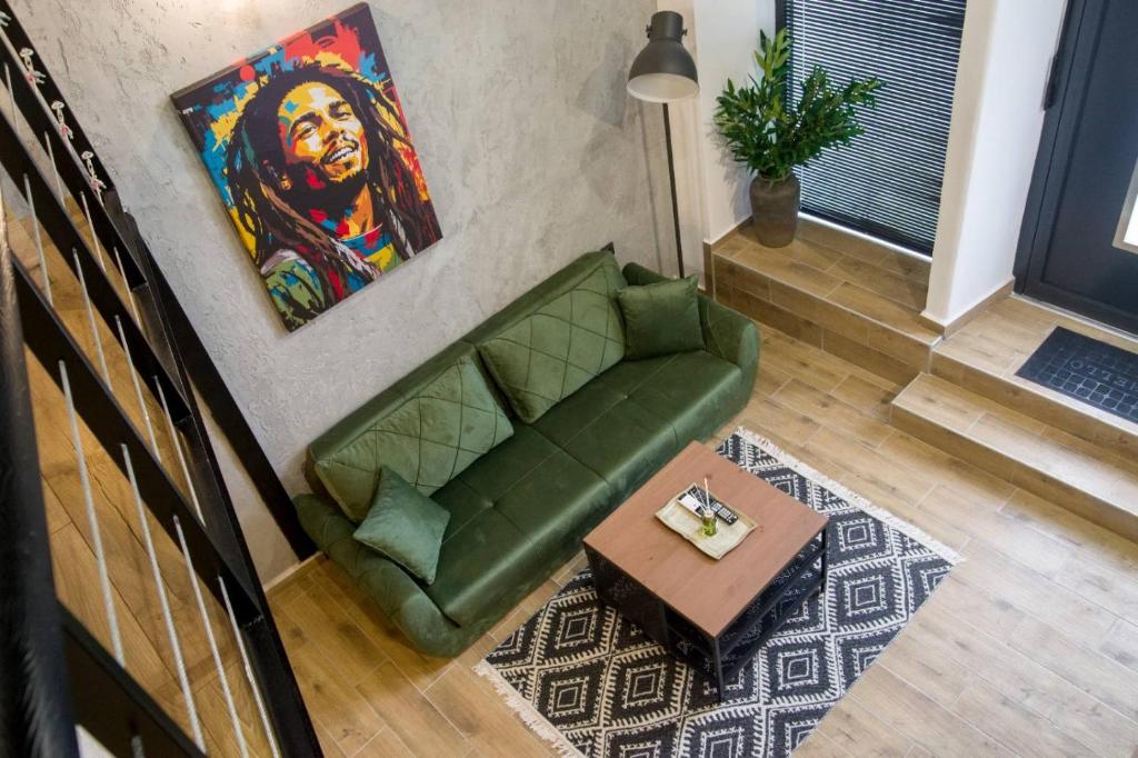 an overhead view of a living room with a green couch at Narnia LOFT in Kavarna