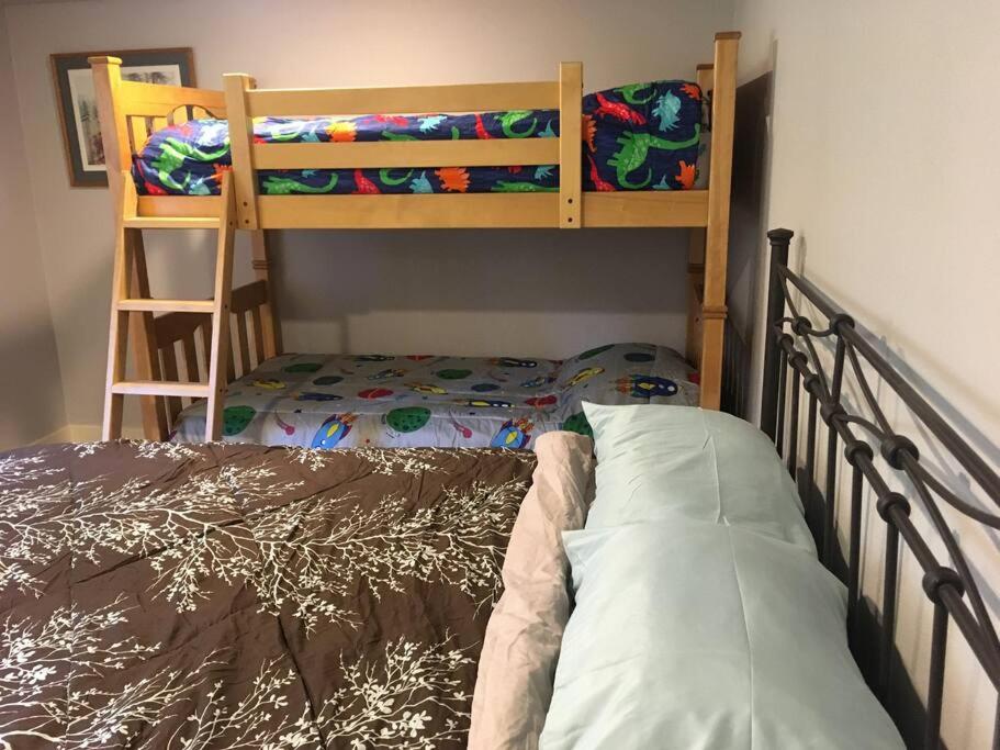 a bedroom with two bunk beds and a bed at Family Friendly, Trampoline, Walk to Everything in West Linn