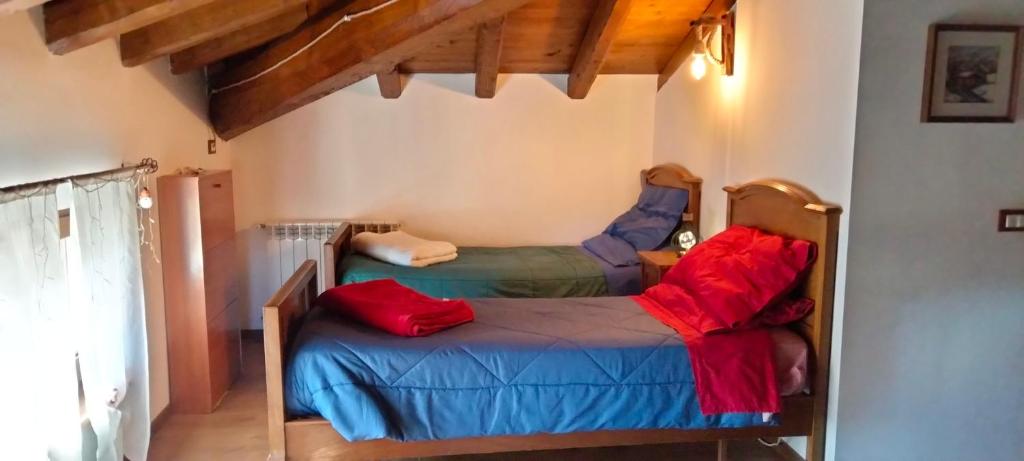 a bedroom with two beds in a room at Villa Amelia in Bracciano