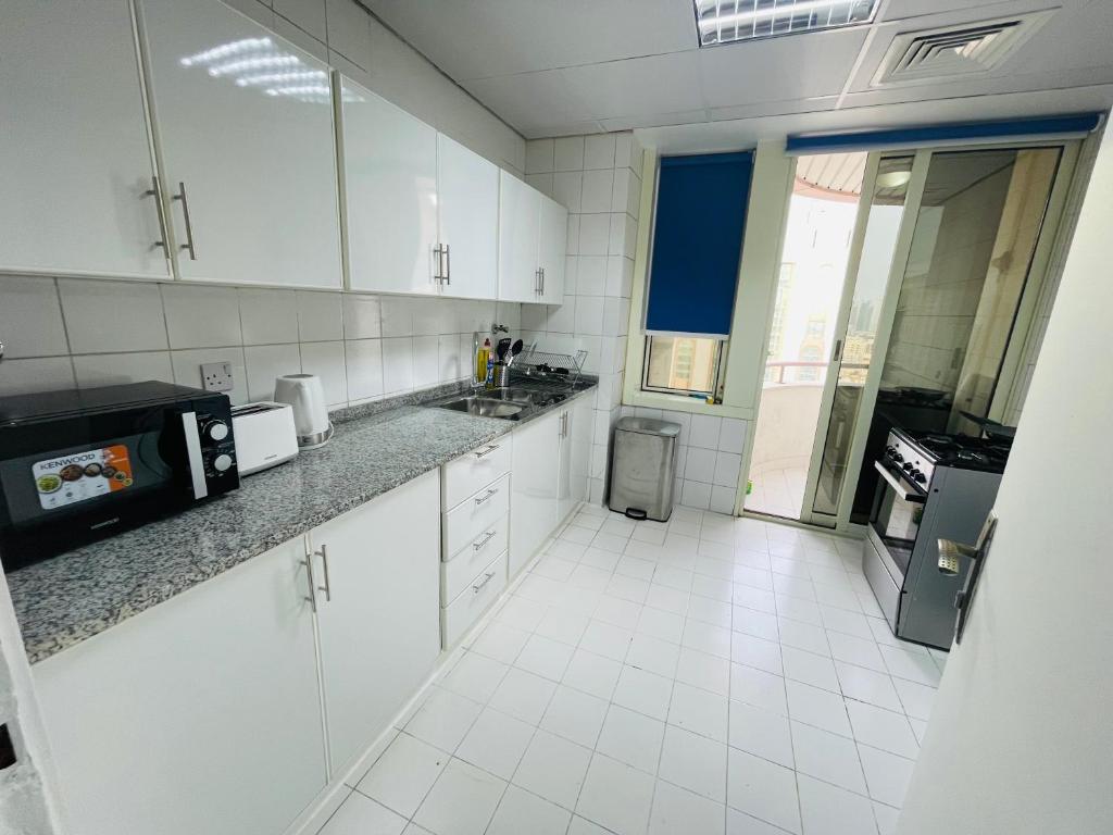 Kuchyň nebo kuchyňský kout v ubytování SG Homes