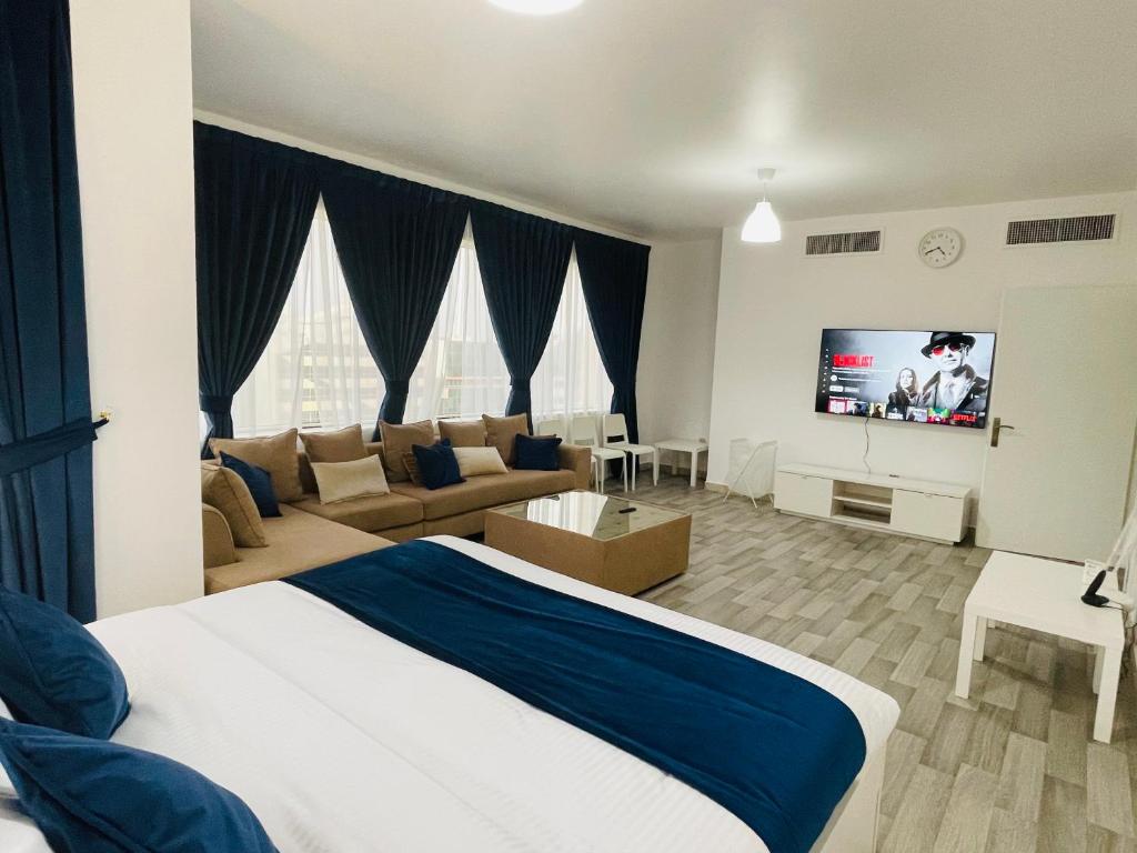 TV a/nebo společenská místnost v ubytování SG Homes