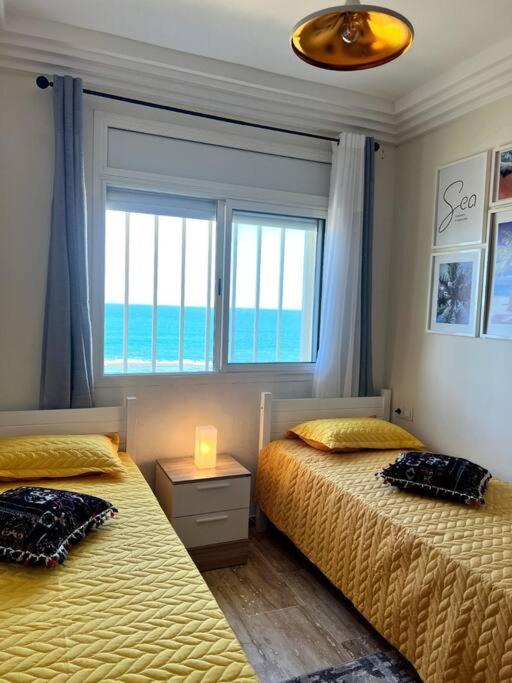 Postel nebo postele na pokoji v ubytování Ocean view sunset apartment in the heart of Rabat