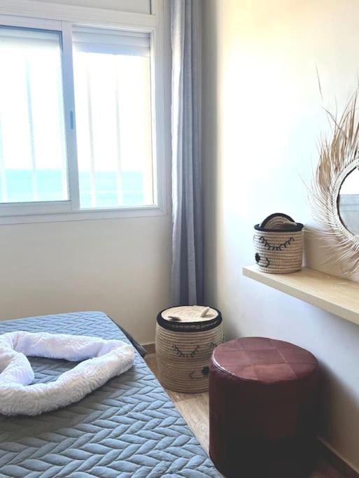 Postel nebo postele na pokoji v ubytování Ocean view sunset apartment in the heart of Rabat