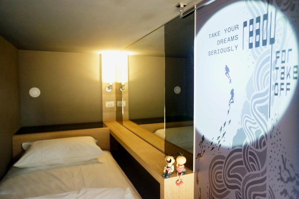 Postel nebo postele na pokoji v ubytování Taipei Discover Hostel