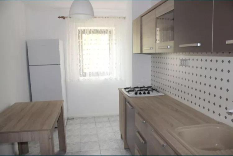 a kitchen with a counter and a stove top oven at apartament Sara in Mangalia