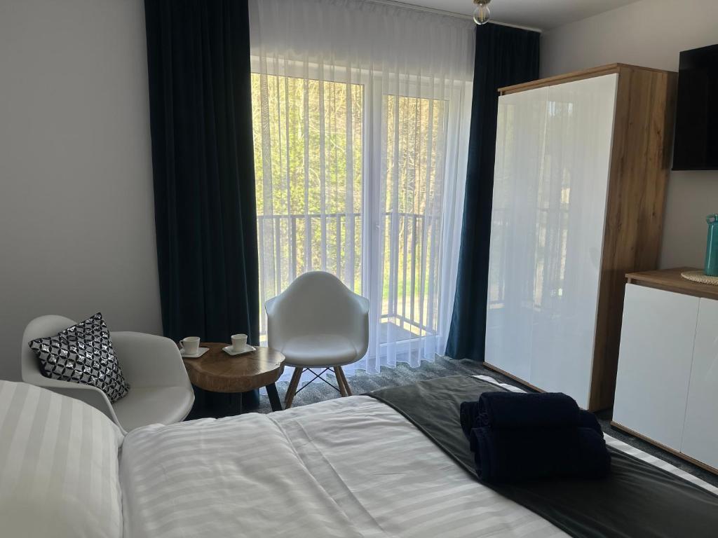 Postel nebo postele na pokoji v ubytování Marina Resort Chłopy