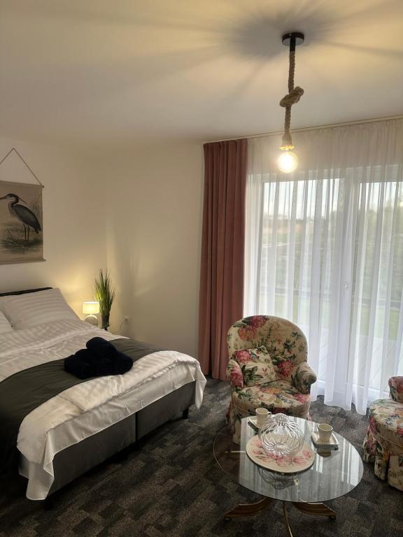 Postel nebo postele na pokoji v ubytování Marina Resort Chłopy