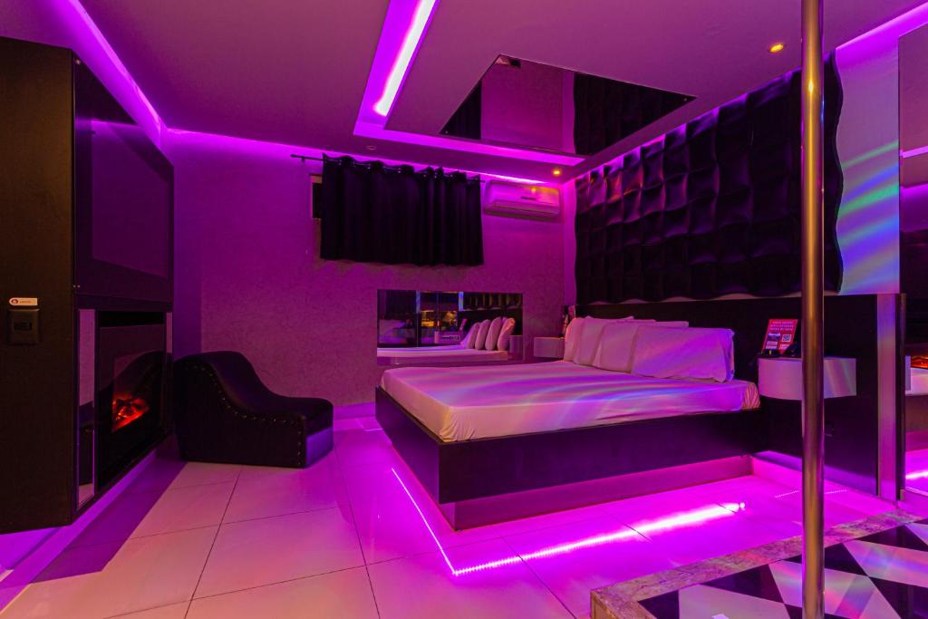 Postel nebo postele na pokoji v ubytování Point Motel GRU