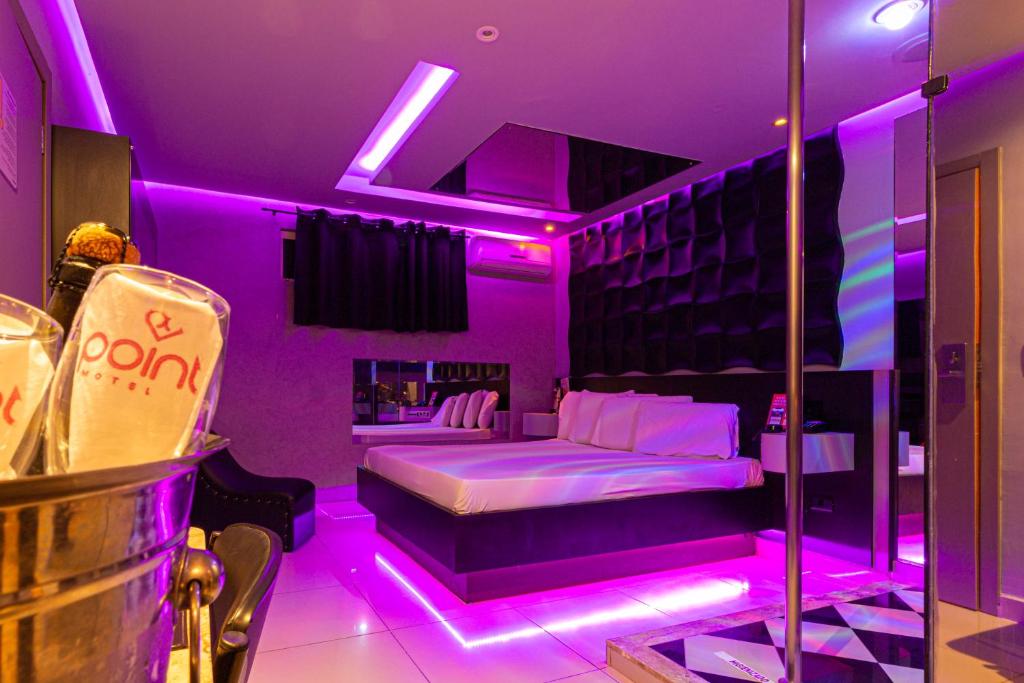 Postel nebo postele na pokoji v ubytování Point Motel GRU