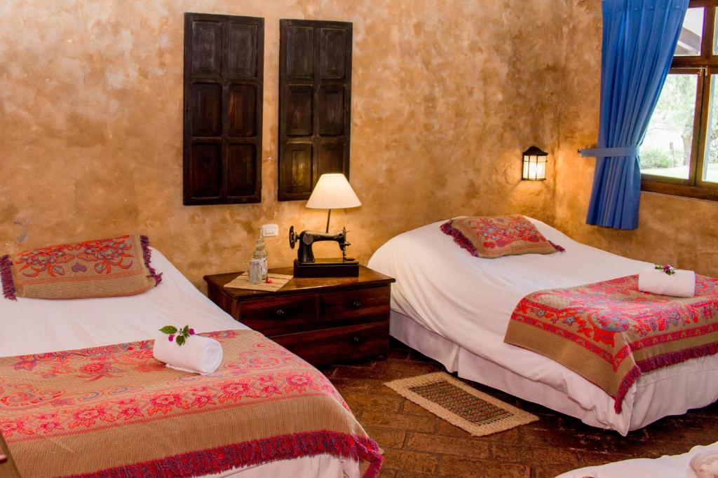 Postel nebo postele na pokoji v ubytování Hacienda San Francisco