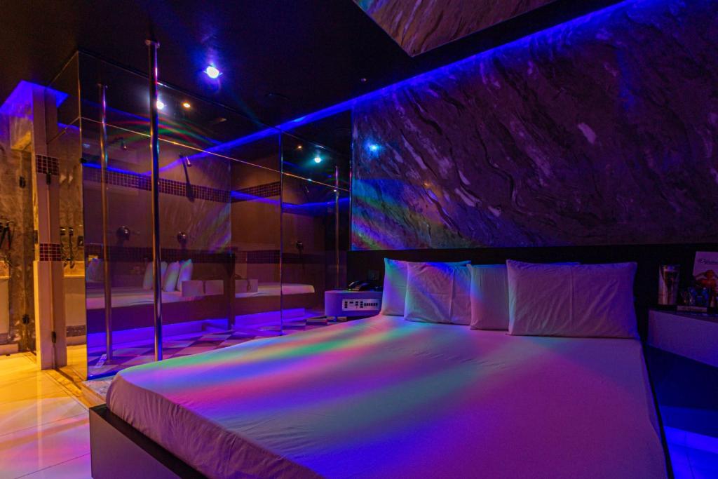 Postel nebo postele na pokoji v ubytování Point Motel GRU
