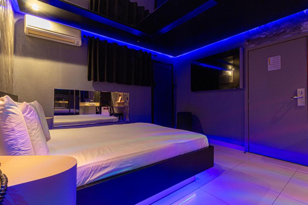 Postel nebo postele na pokoji v ubytování Point Motel GRU