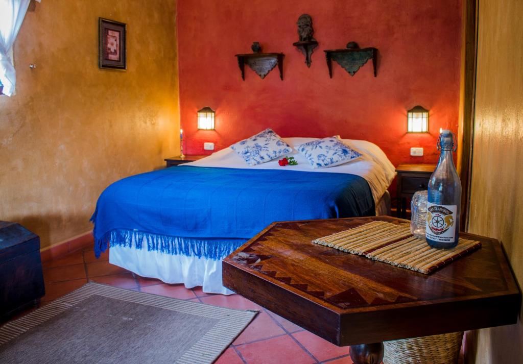 Postel nebo postele na pokoji v ubytování Hacienda San Francisco