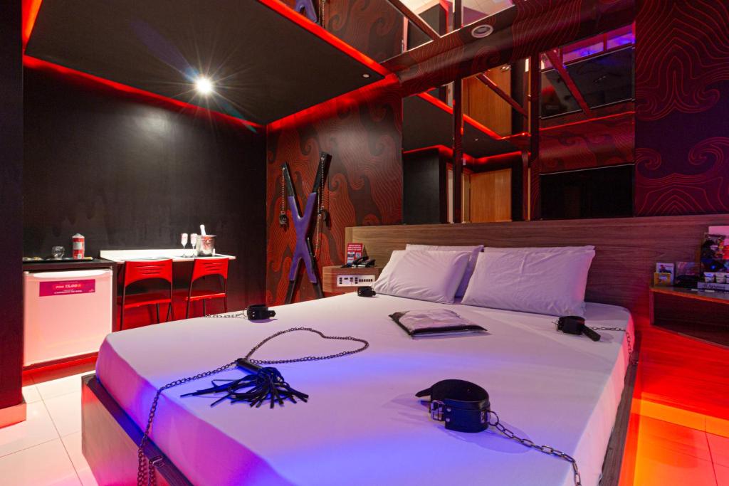 Postel nebo postele na pokoji v ubytování Point Motel GRU