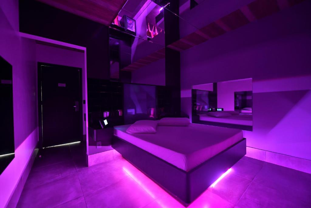 Postel nebo postele na pokoji v ubytování Point Motel GRU