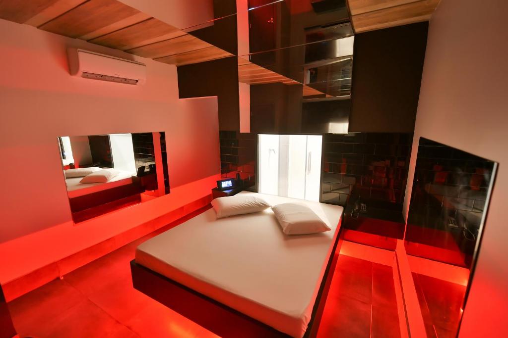 Postel nebo postele na pokoji v ubytování Point Motel GRU