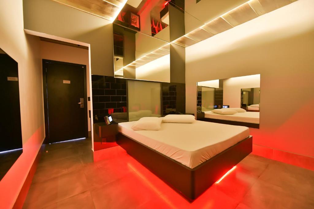 Postel nebo postele na pokoji v ubytování Point Motel GRU
