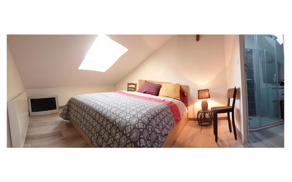 Postel nebo postele na pokoji v ubytování Duplex quartier viarme