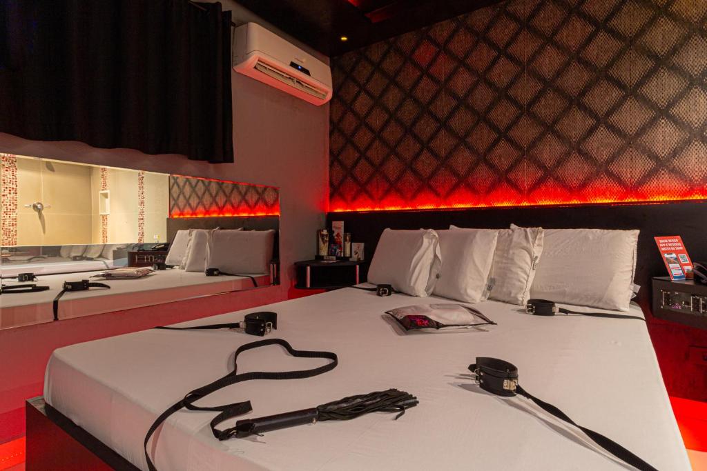 Postel nebo postele na pokoji v ubytování Point Motel GRU