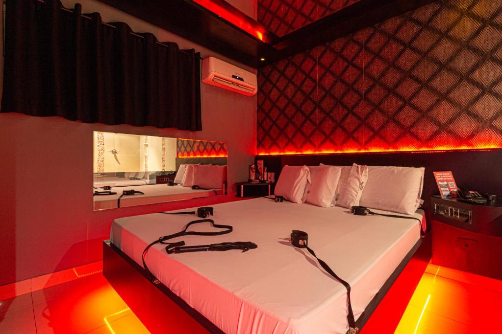 Postel nebo postele na pokoji v ubytování Point Motel GRU