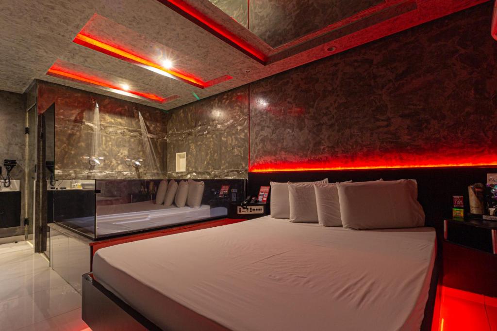 Postel nebo postele na pokoji v ubytování Point Motel GRU