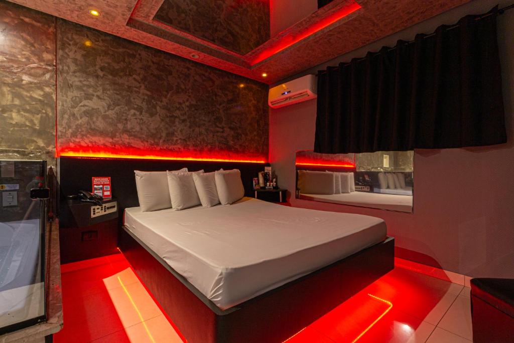 Postel nebo postele na pokoji v ubytování Point Motel GRU