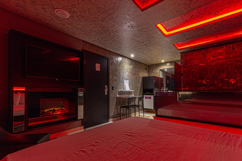 Postel nebo postele na pokoji v ubytování Point Motel GRU