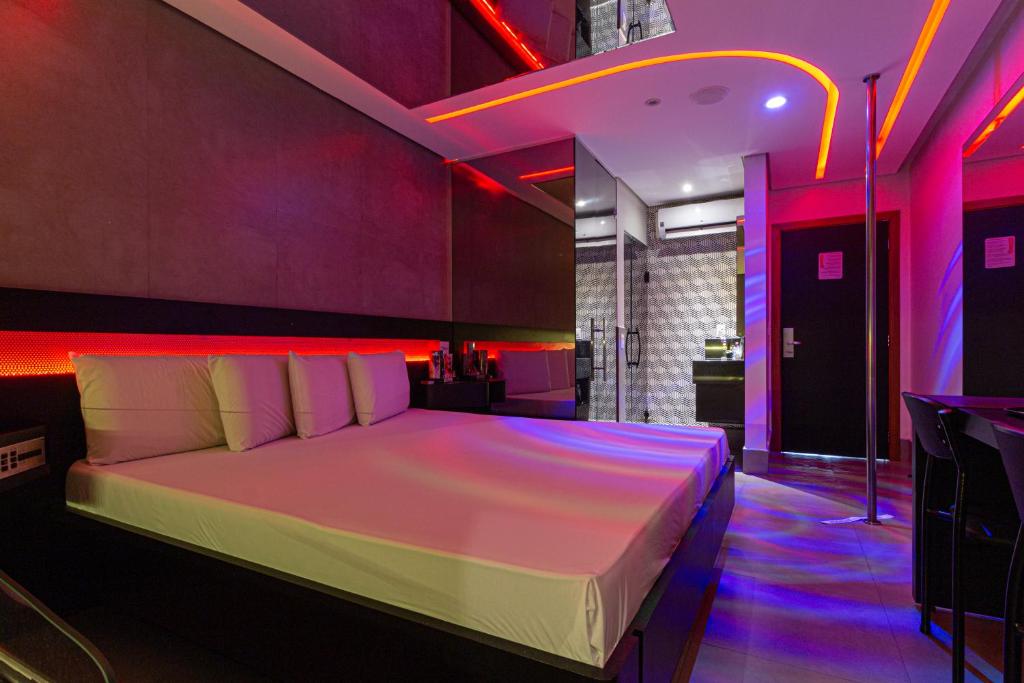 Postel nebo postele na pokoji v ubytování Point Motel GRU