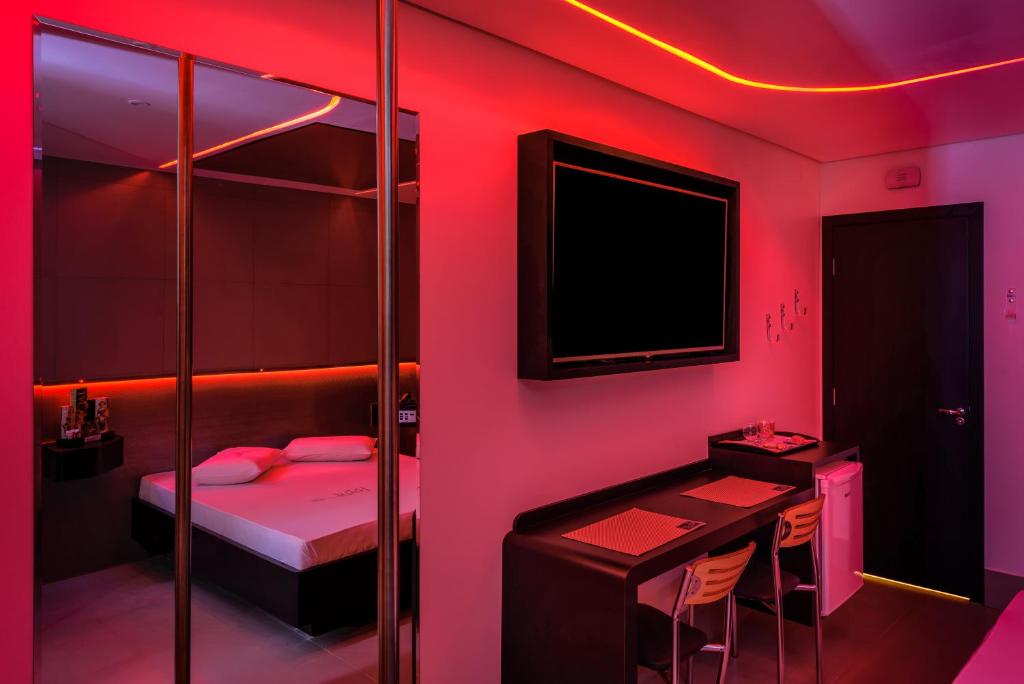 TV a/nebo společenská místnost v ubytování Point Motel GRU
