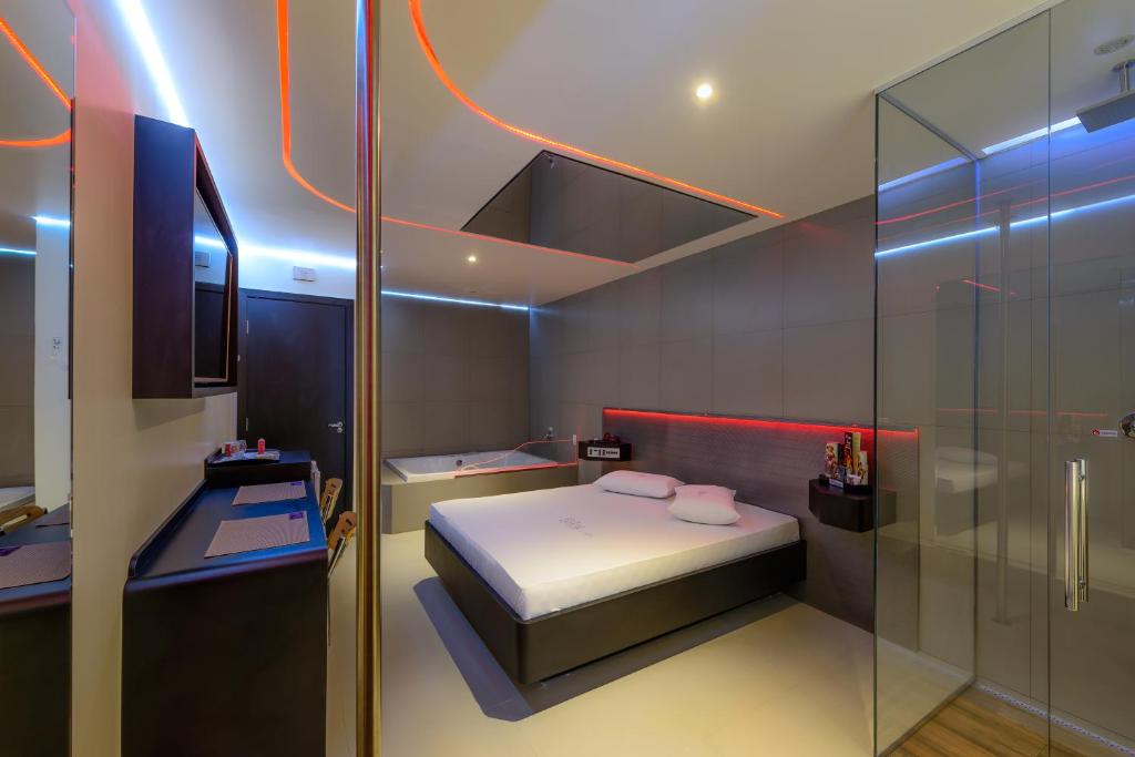 Postel nebo postele na pokoji v ubytování Point Motel GRU