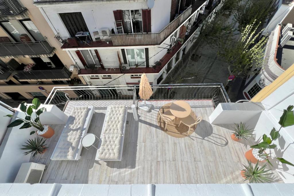 an overhead view of a patio in a building at Aldara Sitges in Sitges