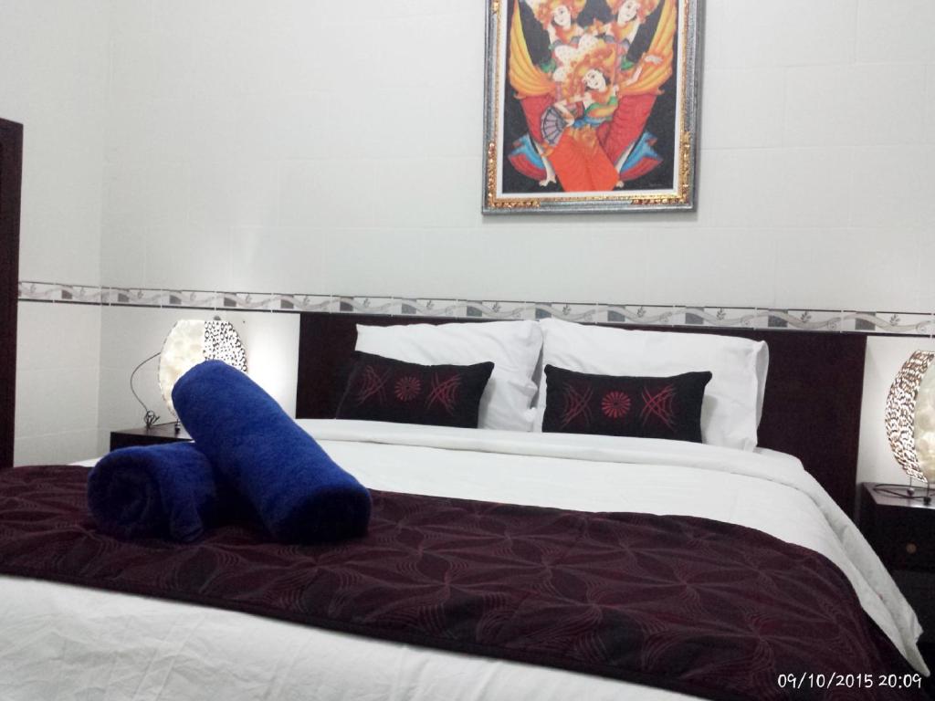 Postel nebo postele na pokoji v ubytování Jepun Segara Guest House