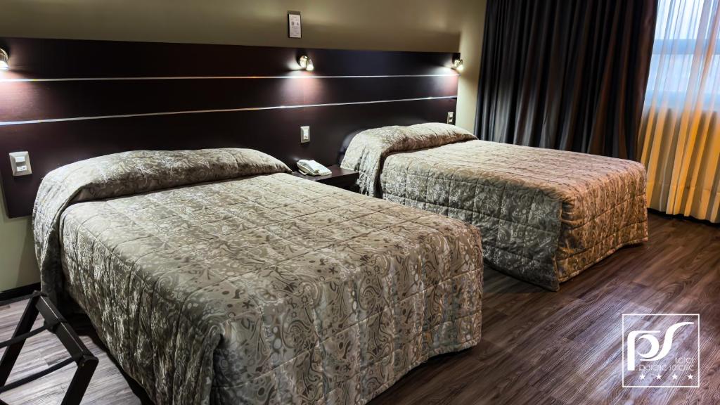 Postel nebo postele na pokoji v ubytování Hotel Parque Satelite