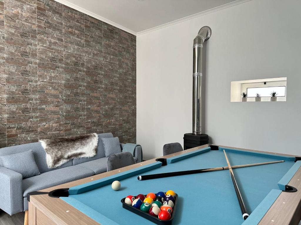 a living room with a pool table at Ferreira House in Seia