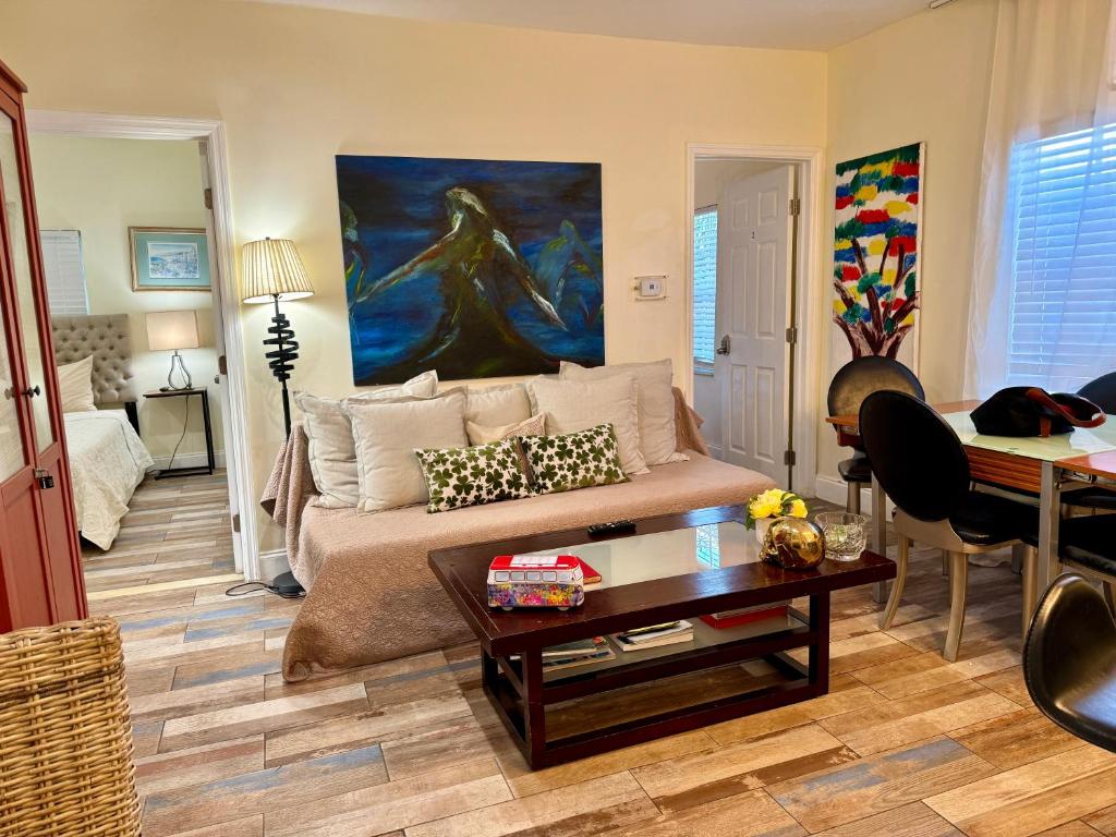 a living room with a couch and a table at Miami Bright townhouse 3 bedroom free Parkig Garden in Miami