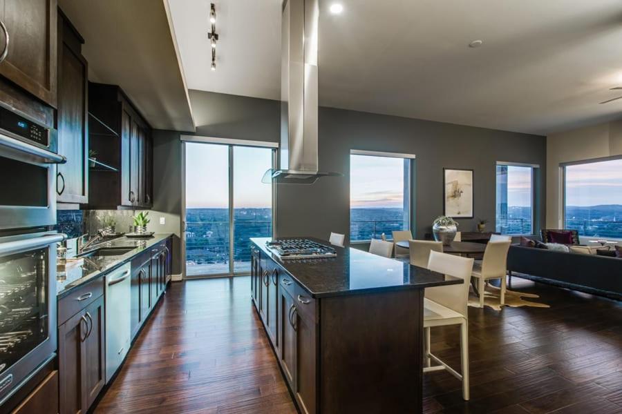 a kitchen with a view of a living room at Casa Catherine in Austin