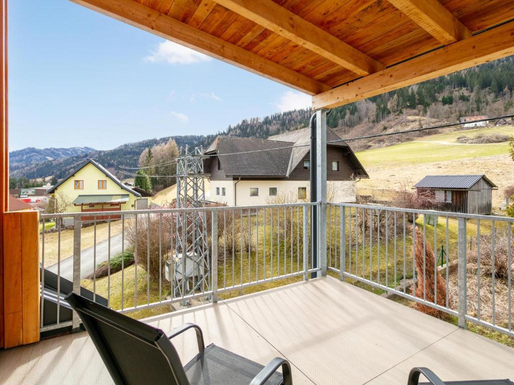 a balcony with chairs and a view of a house at NRV Top 5 in Möderbrugg